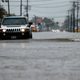 Cars driving through floodwaters in Lake Charles, Louisiana during Hurricane Harvey aftermath. Photo credit: AP Photo/Gerald Herbert
